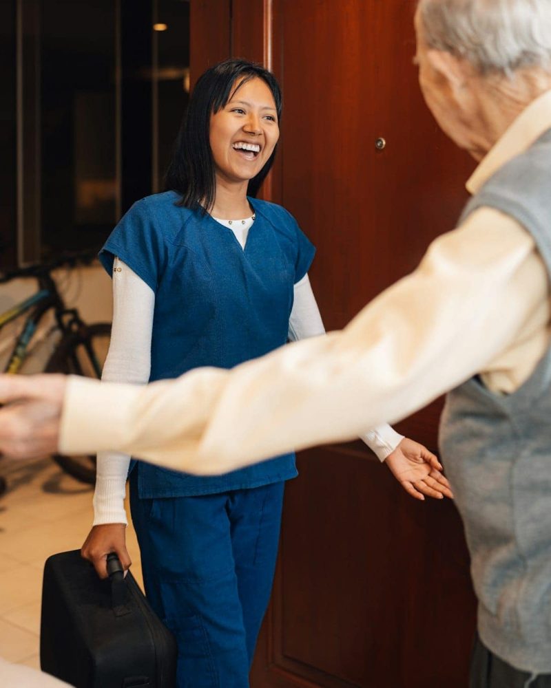 nurse-arriving-at-a-house-to-visiting-an-old-man